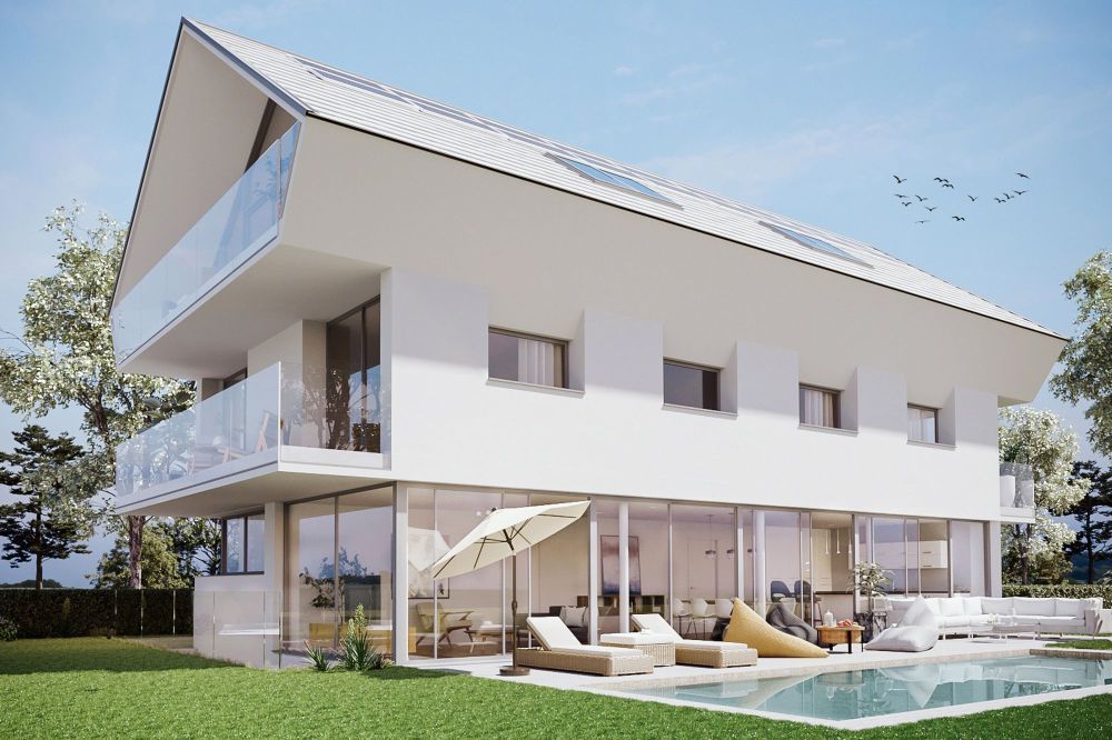 Nouvelle construction d'une villa dessinée par un architecte avec orientation sud-ouest et piscine
